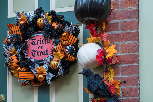 Traditional Halloween wreath hanged on the door of a house in the old quarter of Trenton, New Jersey.