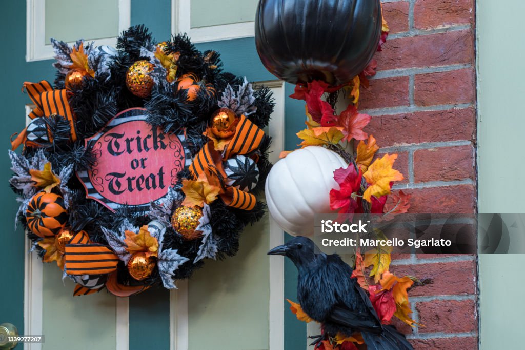 Halloween decoration on the front door Traditional Halloween wreath hanged on the door of a house in the old quarter of Trenton, New Jersey. Halloween Stock Photo