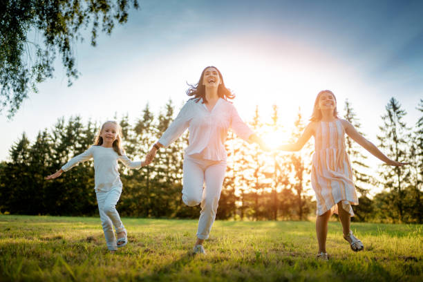 istock Happy family at sunset 1339278232