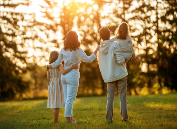 istock Happy family at sunset 1339278379