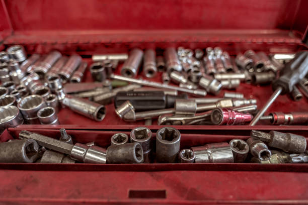 istock Red tool box from a mechanic with sockets of different sizes and a screw driver at a workshop station in Puebla Mexico Latin-America. Selective focus 1339281497