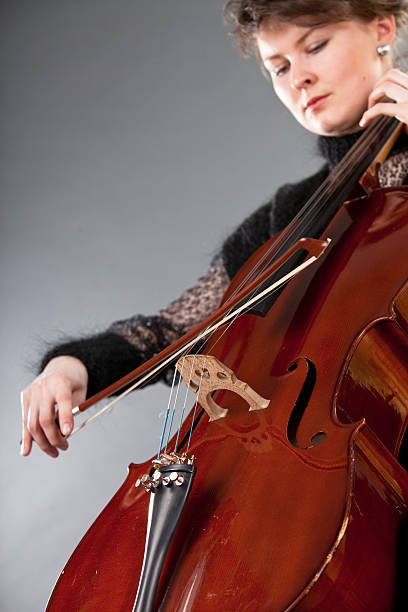 istock Young women play violoncello 133928290