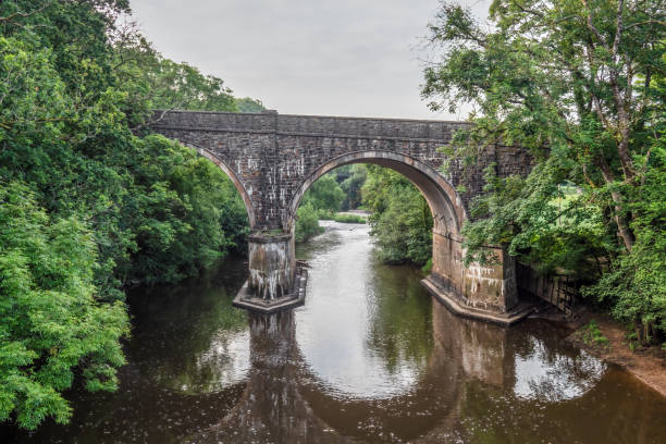 istock Old arched bridge over the River Torridge at Great Torrington, North Devon. 1339284500