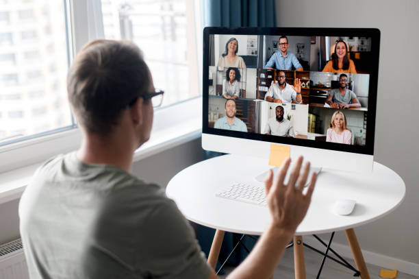 istock Young fit man using app for distance video communication with coworkers 1339286099