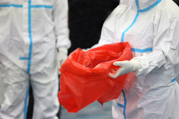 medical waste or clinical waste disposal is a hazardous waste clear old ppe in red garbage plastic bag - bio hazard imagens e fotografias de stock