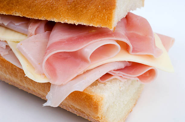 Ham and cheese sandwich Ham and cheese sandwich on a baguette (macro picture), this sandwich is called poor boy in the US ham and cheese sandwich stock pictures, royalty-free photos & images