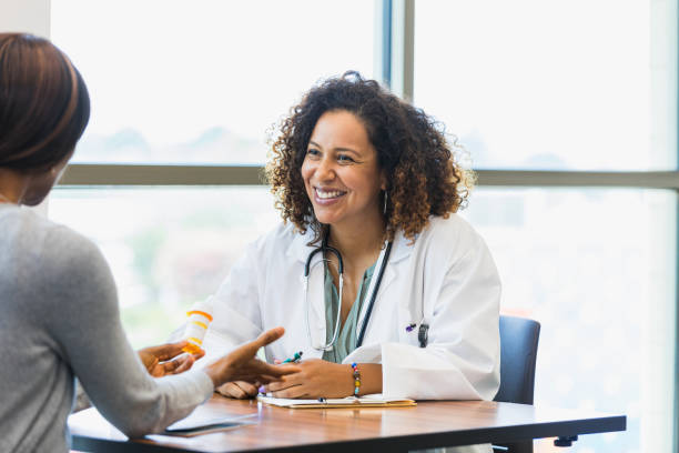 istock Unrecognizable patient asks smiling female doctor about prescription 1339289874
