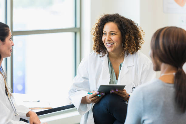istock Multi-ethnic group of medical professionals meet together 1339289901