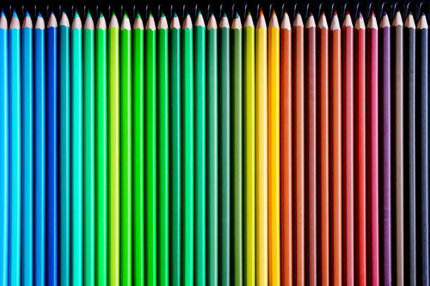 Colored pencils lined up in a row background