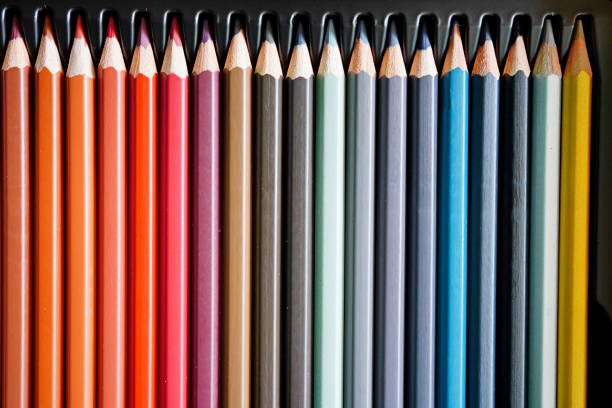istock Pencils lined up in a row background 1339291308