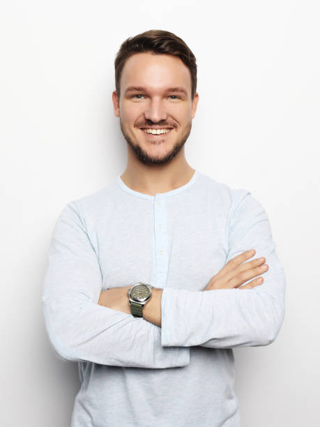 istock Handsome young man in smart casual wear looking at camera 1339292635