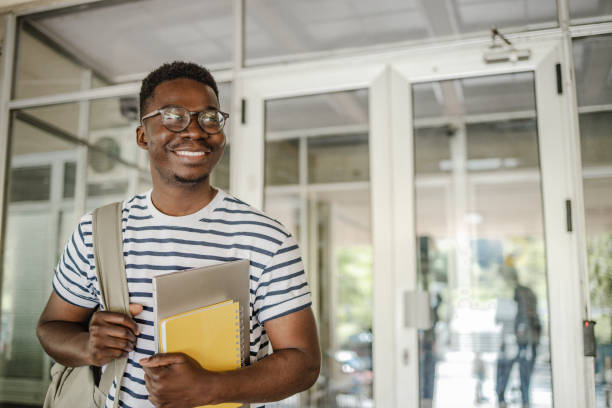 istock University student carrying a laptop 1339293194