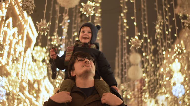 Family in the city in Christmas Eve