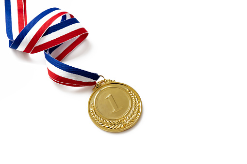 Number one and laurel wreath gold medal. Champion first place winner athlete. Prize in sport trophy award and red and blue ribbon isolated on white background.