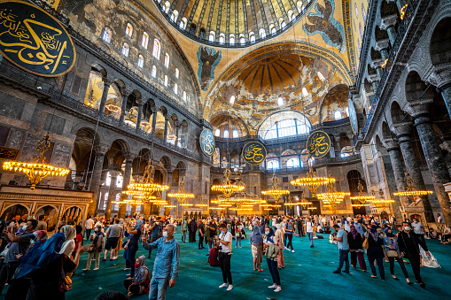 Istanbul, Turkey - September 07,  2021: Large group of people and tourists visit Holy Hagia Sophia Grand Mosque (Ayasofya-i Kebir Cami-i Şerifi), Istanbul Turkey