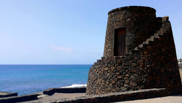 Costa Teguise, Lanzarote, Spain - August 20, 2021: view of a tower in Bastian beach in Costa Teguise
