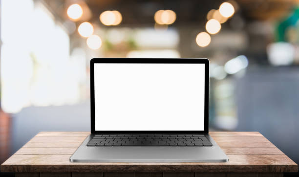 istock Laptop with blank screen on table with blurred restaurant background 1339299967