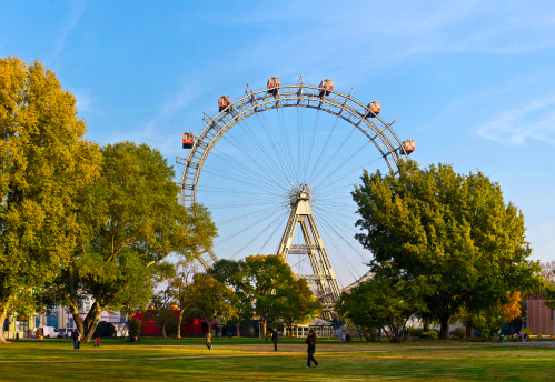 Historic ferris wheel of Vienna with the so called Kaiserwiese (meadow) in front.