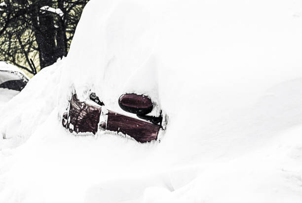 istock Car after Snow Storm Blizzard, Snow-covered car during a winter blizzard 1339304985