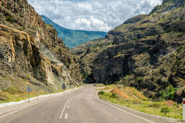 Roadtrip in USA Southwest: on the scenic highways in the desert. On the road style vacations, straight road ahead