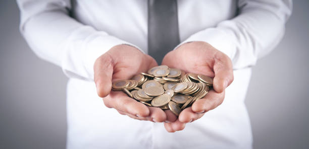 istock Man showing coins. Business. Finance 1339311746