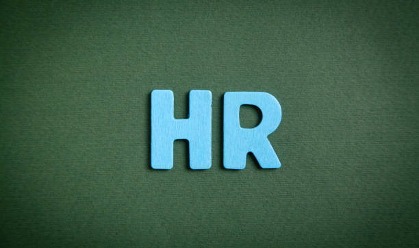 istock Blue word HR on green background. 1339311747