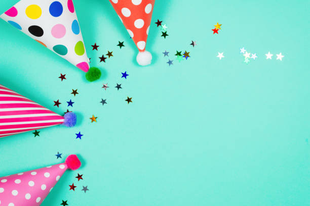 istock Colorful birthday caps on a blue background. Top view. 1339313214