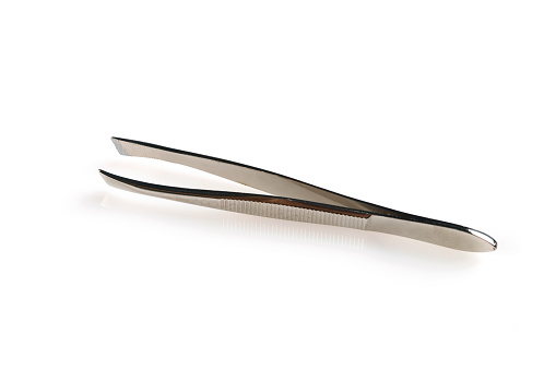 a small metal folding pair of scissors