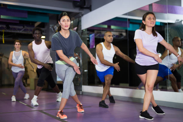 istock Young adult people training in dance studio 1339314530