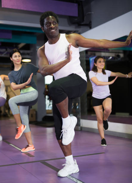 istock Group of people practicing together in gym 1339314537