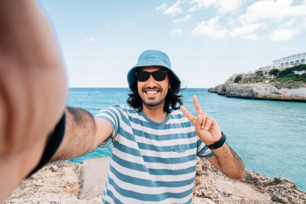 istock A man is taking a selfie near the sea 1339317431