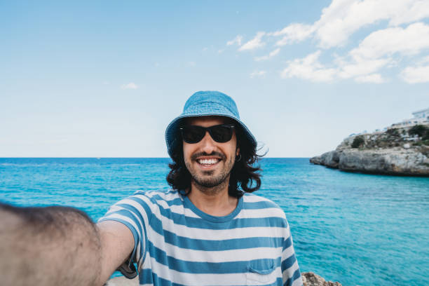 istock A man is taking a selfie near the sea 1339317433