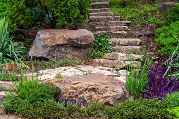 istock Stairs made of natural stones surrounded by greenery 1339326310