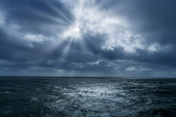 Cloudburst over ocean stock photo