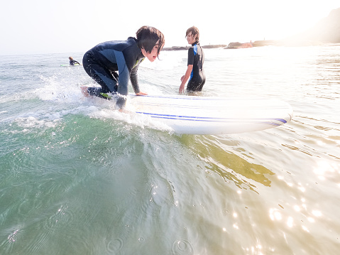 Father takes his children surfing in beautiful Santa Barbara, California