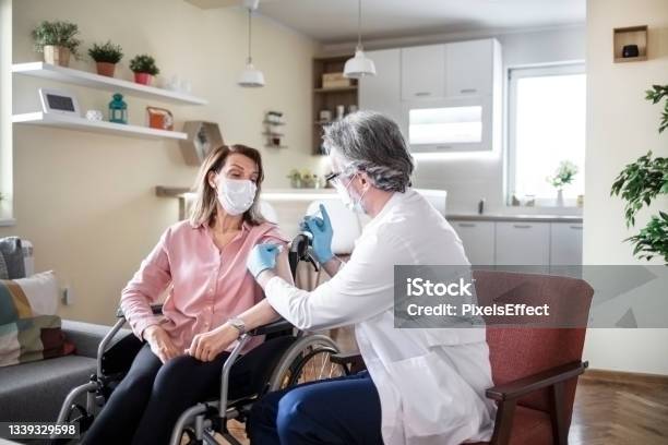Vaccination For Homebound People Stock Photo - Download Image Now - 50-54 Years, 55-59 Years, Adult