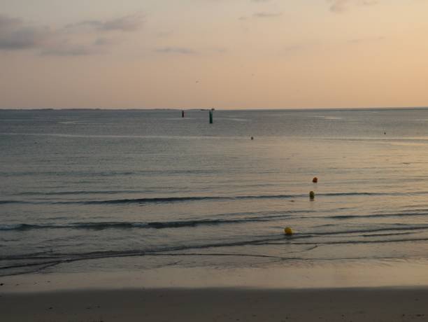 End of a sunny day on the large beach of Quiberon in Brittany, Morbihan and end of summer holidays 2021