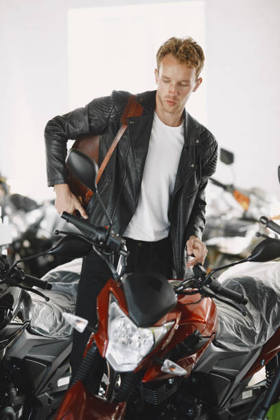 istock Handsome man choosing a motorcycle to buy 1339335789