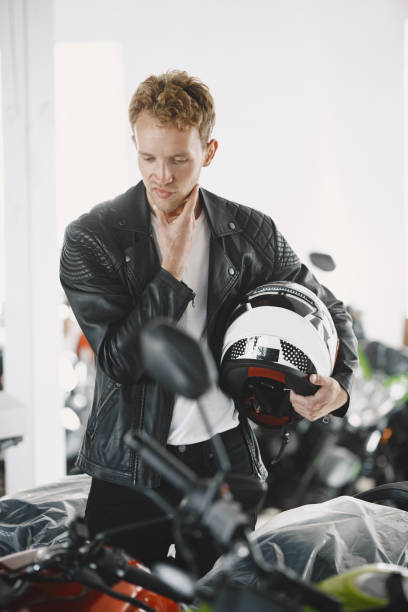 istock Handsome man choosing a motorcycle to buy 1339335791