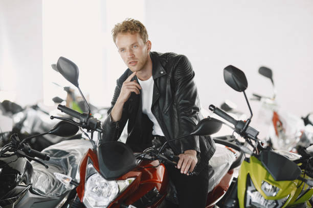 istock Handsome man choosing a motorcycle to buy 1339335794
