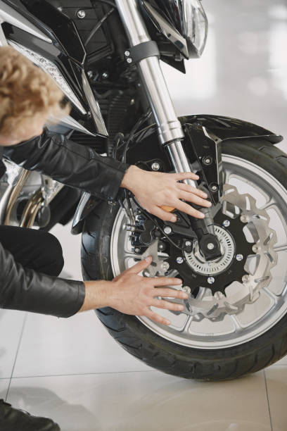 istock Handsome man choosing a motorcycle to buy 1339335830