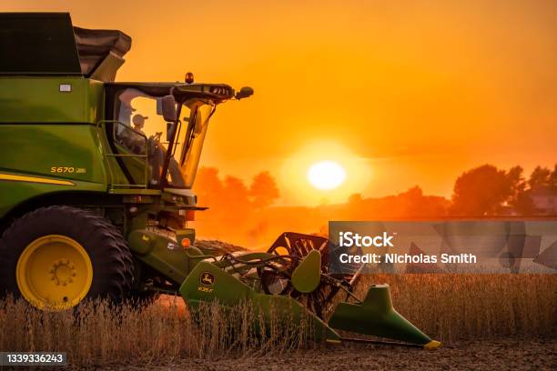 John Deere S670 Soybean Sunset Stock Photo - Download Image Now - Agriculture, Tractor, Farmer
