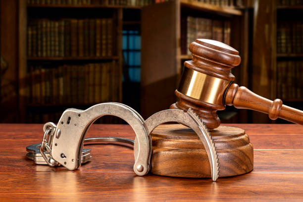 istock Handcuffs and gavel in law library 1339340370