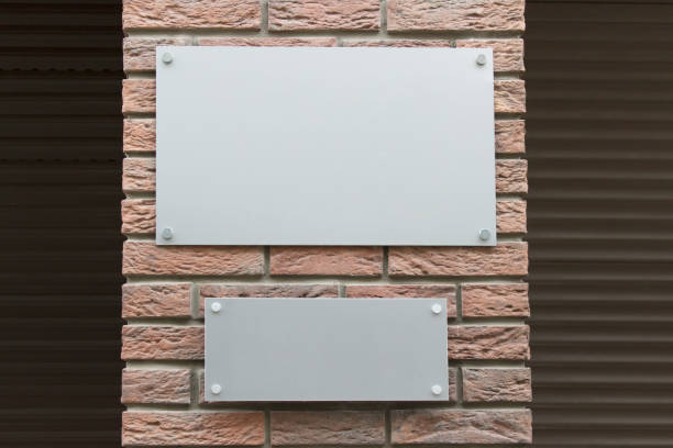 Mockup template with two blank metallic boards on street building facade stock photo