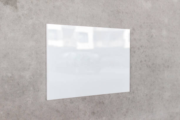 istock Large white glossy square billboard banner board hanging on gray concrete wall 1339341057