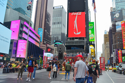 New York City, New York, USA.  July 19, 2021.  Visitors and tourists gather around Father Duffy Square to get a better view of Times Square.