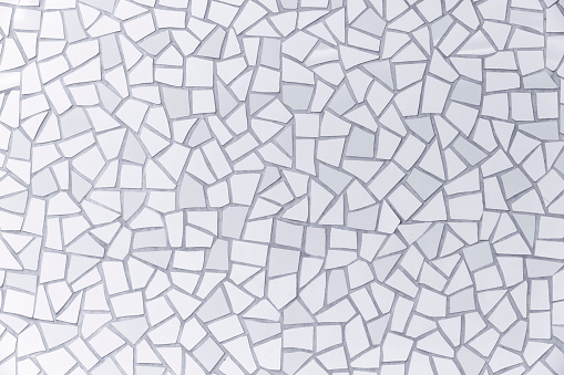 White broken tiles pattern, abstract background with copy space, full frame horizontal composition