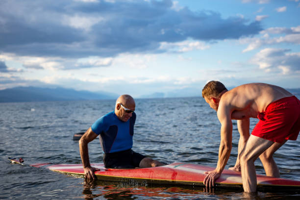 istock Male kayakers preparing to push off for kayaking 1339344308