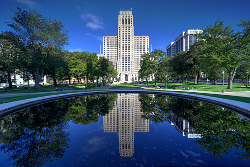 Alfred E. Smith building, reflected in a pool. Albany NY