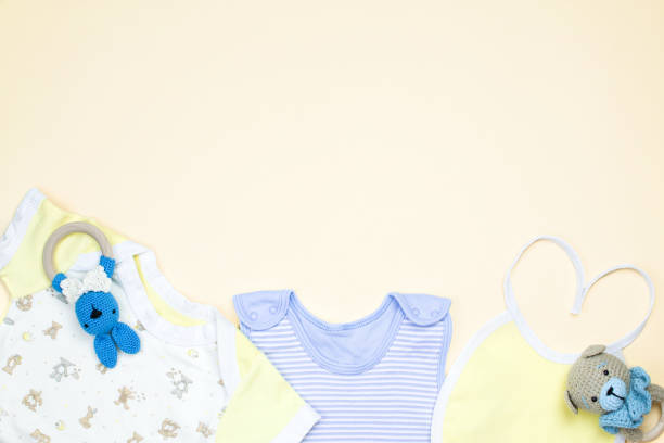 istock Flat lay composition with baby clothes and accessories beige background, space for text 1339349040